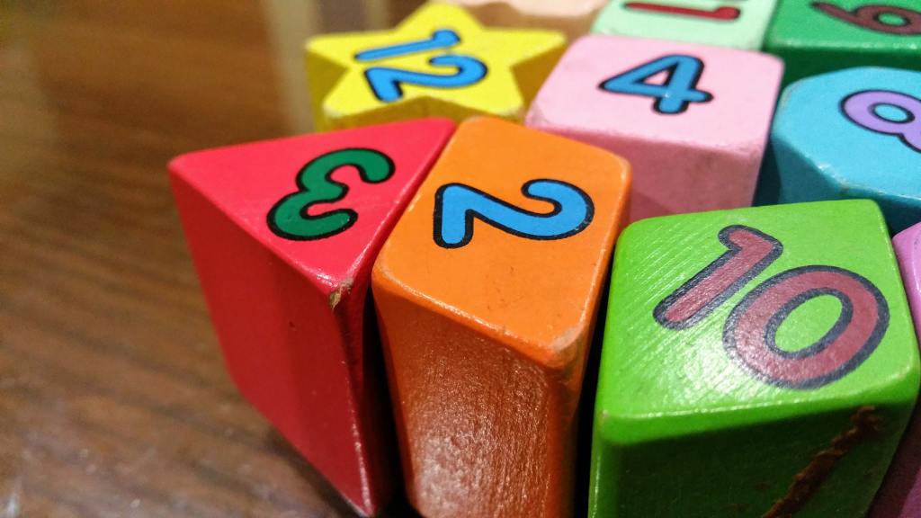 Colorful blocks of different shapes with numbers. Self-editing tips for numbers in Chicago Style.