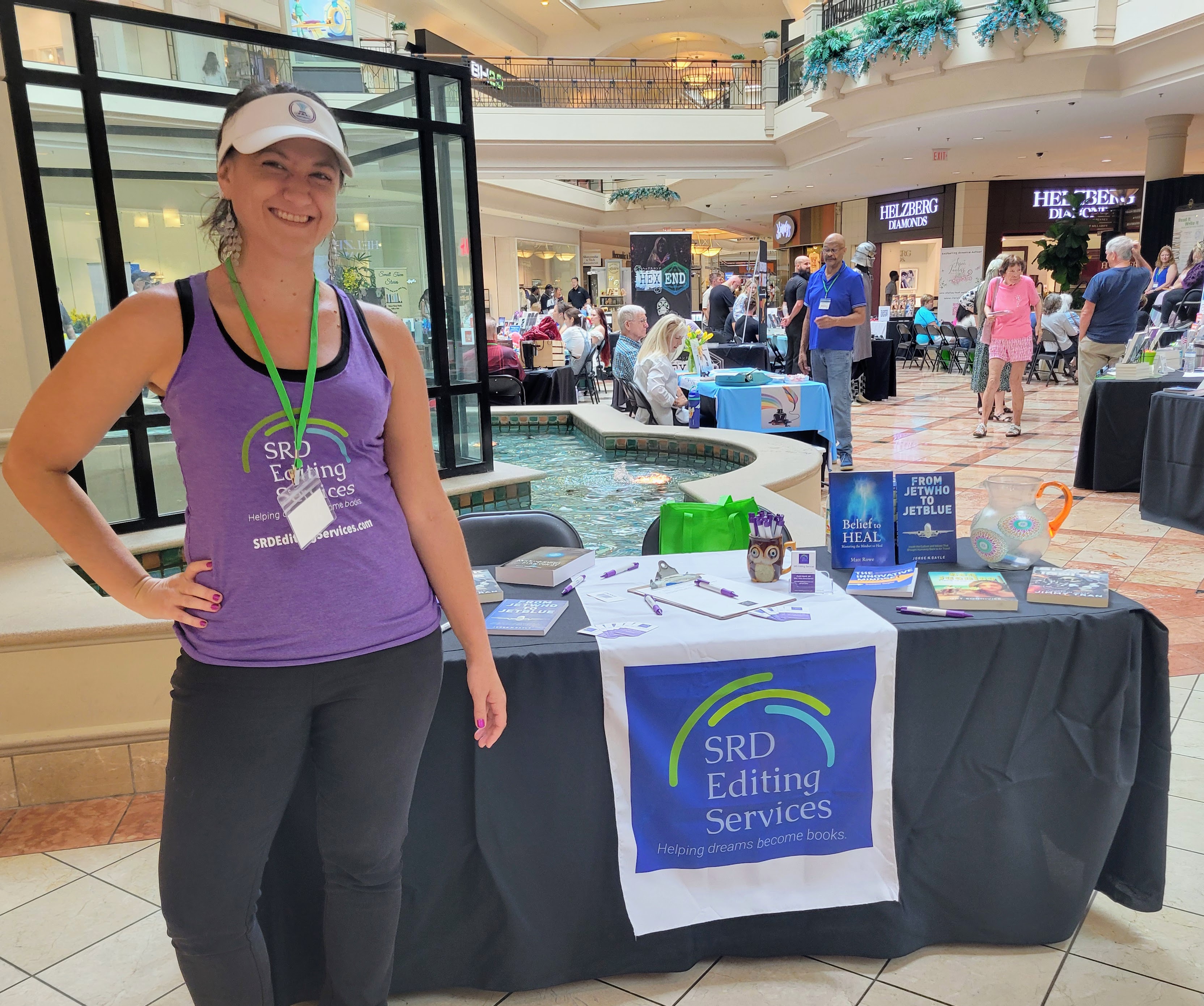 Cortni Merritt MA stands next to her table at the Read It Write It book festival in Wellington Florida on June 14, 2024