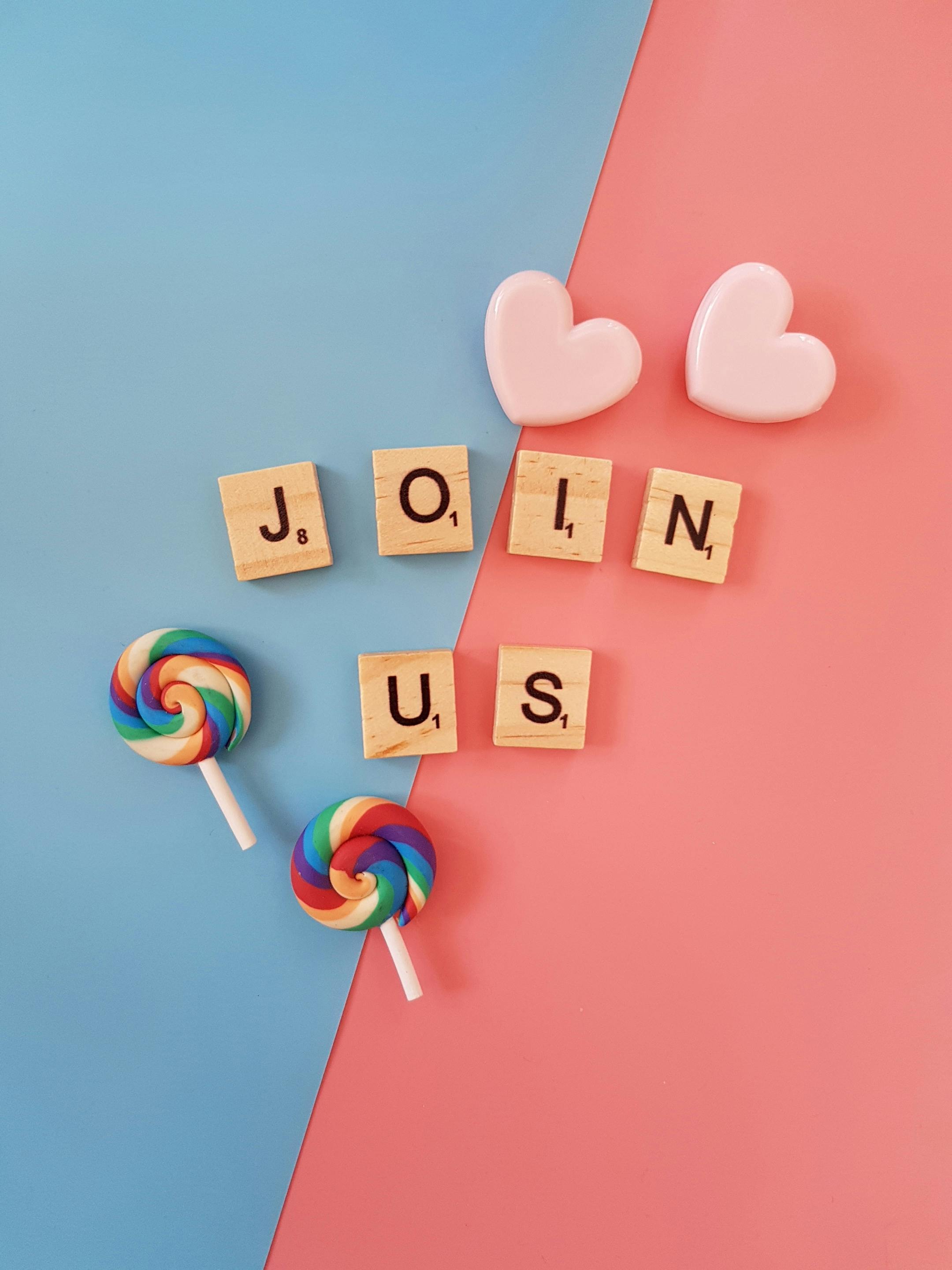 Candy and tiles that spell "join us"; announcing newsletter launch
